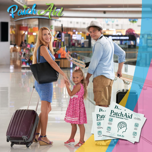 A woman and a man stand in an airport terminal, smiling and holding hands with a young girl in a pink dress, while a suitcase and PatchAid Motion Sickness Patches are visible nearby.