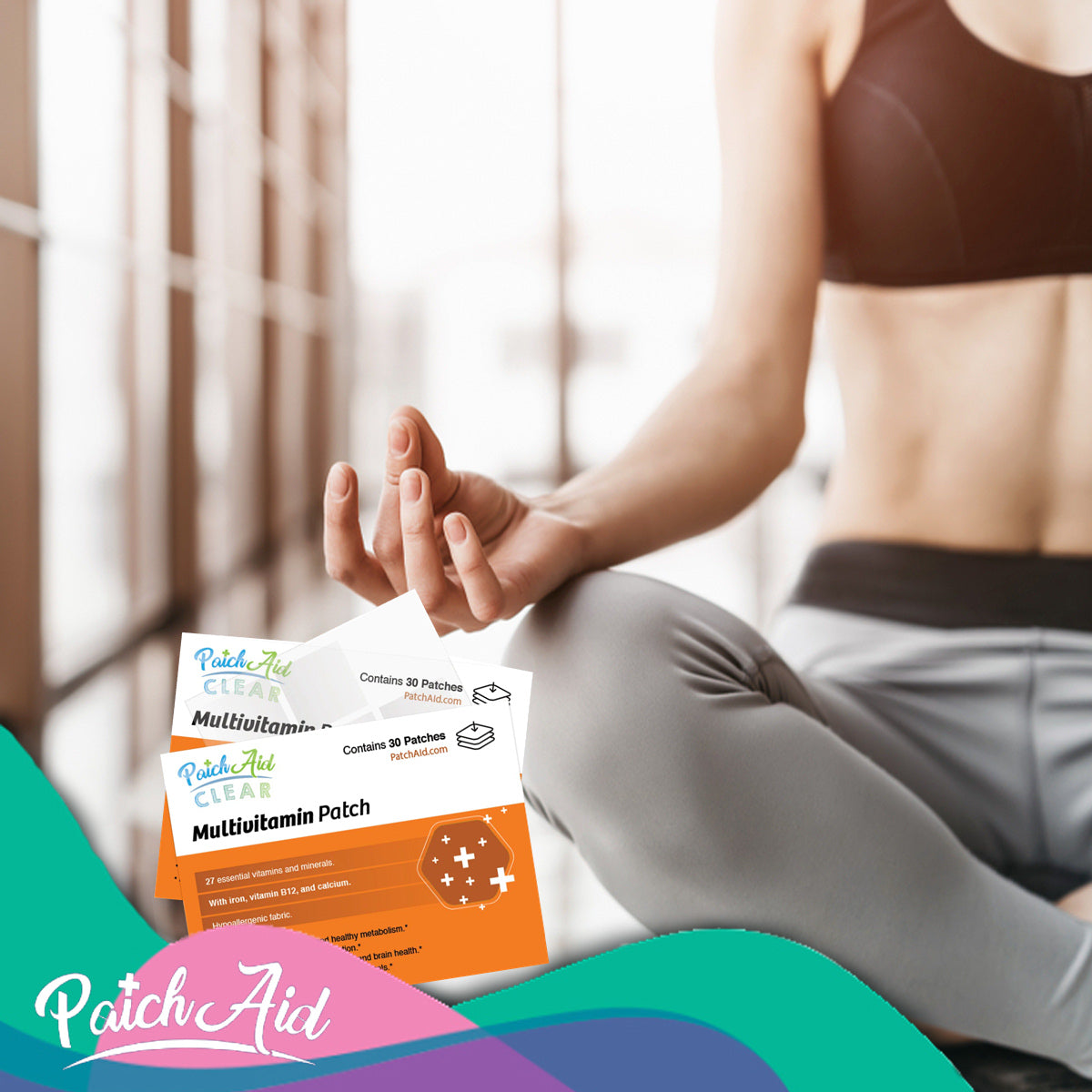 A person in athletic wear sits cross-legged in a bright, modern space, holding a meditative pose while displaying PatchAid multivitamin patches in front of them.