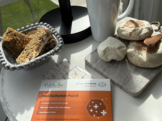 PatchAid Multivitamin Patch box displayed beside breakfast snacks, a white mug, and visible adhesive vitamin patches.