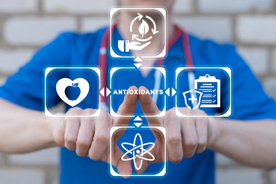A person in a blue shirt points at icons representing antioxidants, health, and scientific concepts, emphasizing the importance of antioxidants in wellness and innovative delivery methods like PatchAid patches.