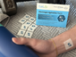 Electrolyte hydration patch applied to a person’s wrist, with multiple unused patches and PatchAid packaging visible in the background, highlighting daily wellness and hydration support.