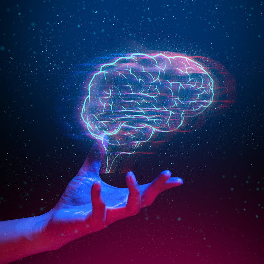A glowing, digital representation of a brain hovers above an outstretched hand against a starry blue and pink background, symbolizing creativity and knowledge.