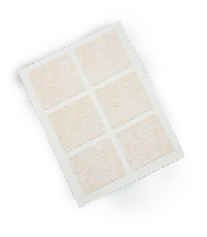 A sheet of six square medical adhesive pads set against a black background.